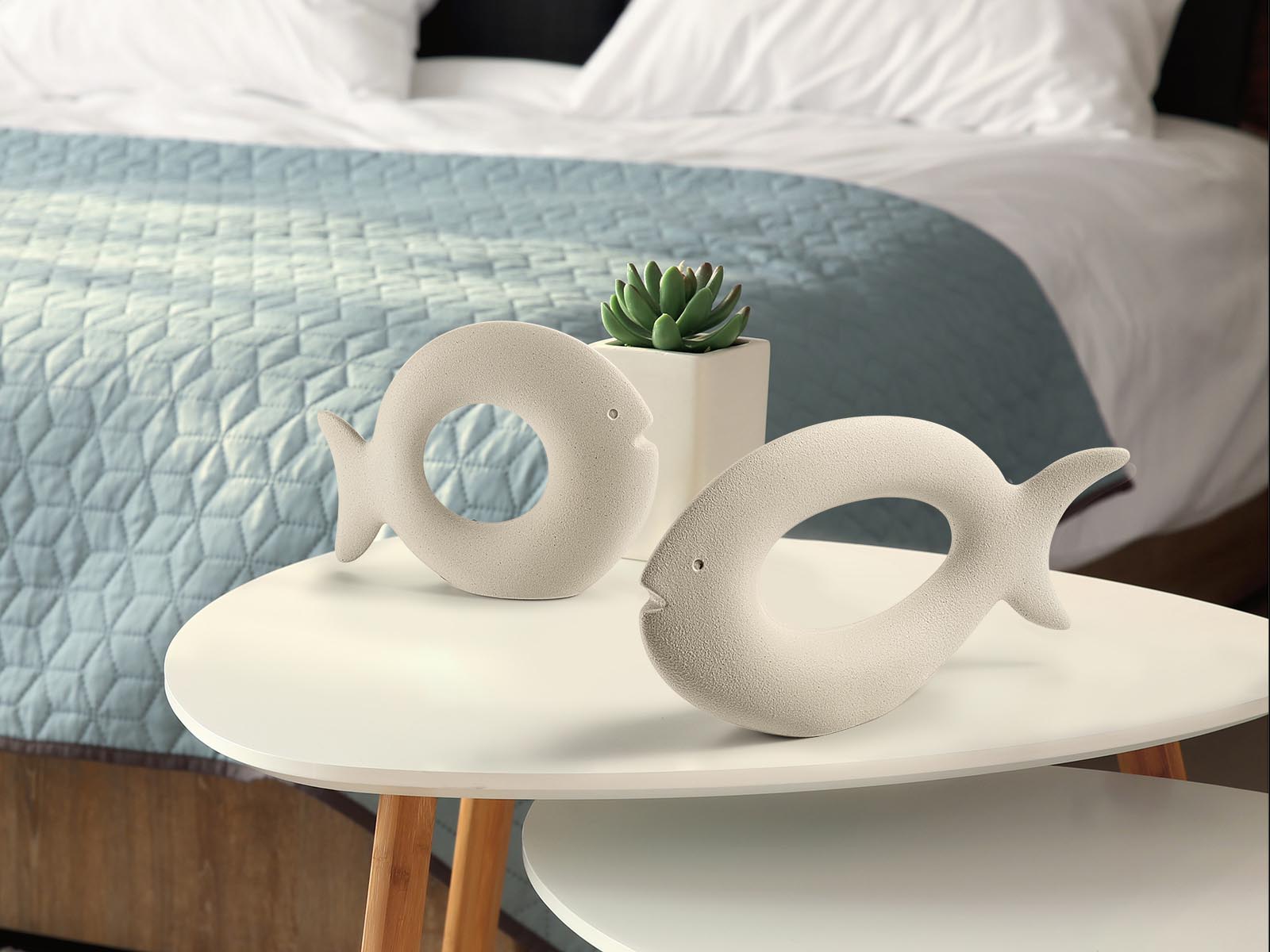 Houseplants on table in modern bedroom